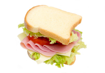 Slices of bread with ham and salad on white background