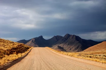 dusty road in the mountainous landscape of central Namibia