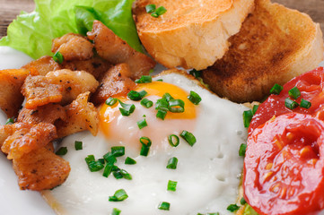 Breakfast. Snack. Eggs, chicken and tomatoes.