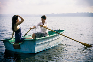 Newly married couple in honeymoon vacation on lake in Italy