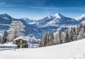 Idyllic winter landscape the Alps with mountain chalet