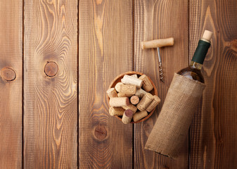 White wine bottle, corks and corkscrew