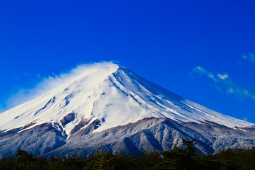 Close up of sacred mountain of Fuji on  top covered with snow in