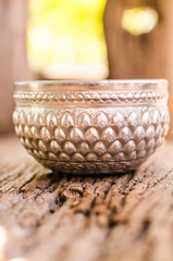 metal bowl on wooden background