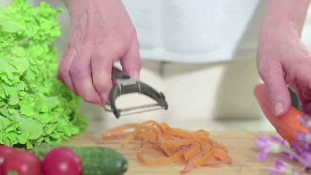 Peeling carrots, closeup