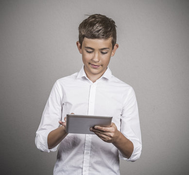 Teenager boy holding portable pc browsing internet