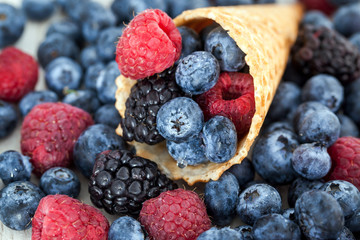 Fresh berries in waffle cone