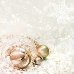 Fototapeta na wymiar Golden Christmas decorations on winter background