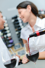 Pouring wine  for a couple