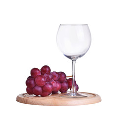 Glass of red wine and grapes, isolated on white