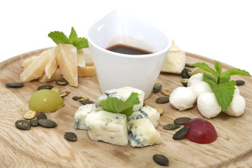 cheese plate with a large decorated the assortment of mint