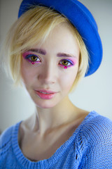 Portrait of young beautiful girl with pink makeup