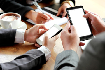 group of business people using smartphone