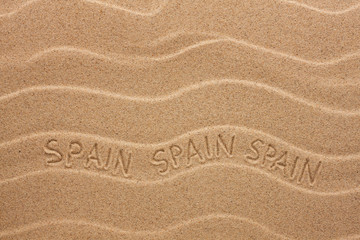 Spain inscription on the wavy sand