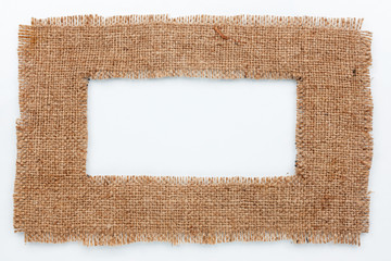 Frame of burlap, lies on a white background