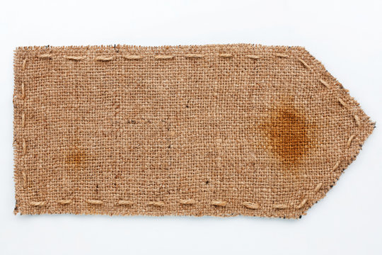 Arrow of burlap  lies on a white  background