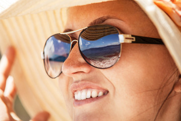 Close up woman portrait in big summer hat