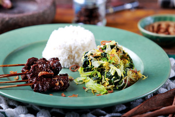 indonesian cuisine goat satai served with indonesian salad and r