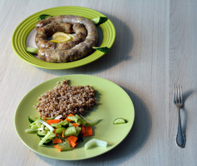 homemade pork sausage served with garnish of boiled buckwheat wi