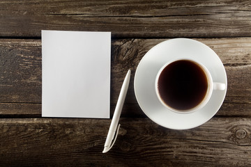 Obraz na płótnie Canvas Blank with pen and cup of coffee