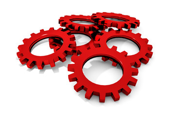 stack of red colored metallic cogwheels on white surface