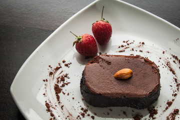 Dessert chocolate cake on a white plate.