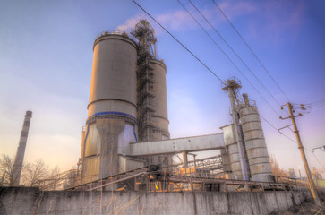 Cement factory on sunset