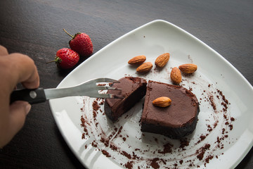 Dessert chocolate cake on a white plate.