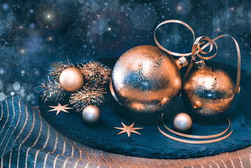 Golden Christmas decorations on dark background