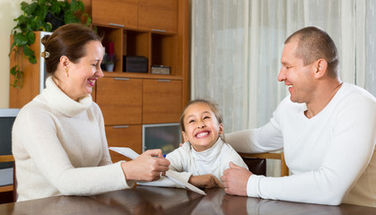 Father and daughter complete a questionnaire