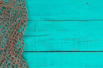 Blank teal blue sign with fish net border