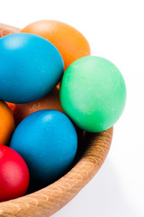 easter eggs and wooden plate isolated on white