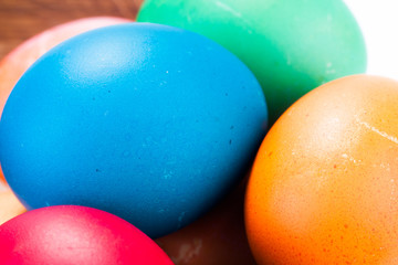 easter eggs and wooden plate isolated on white