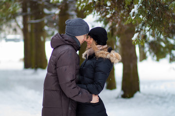 Happy Couple Having Fun Outdoors. Snow. Winter Vacation. Outdoor