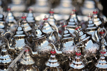 Metal kettles on display in Moroccan market