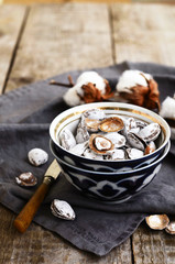Salty apricot pits in oriental ceramic pattern bowl