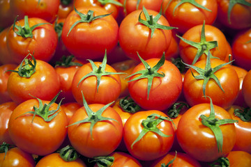 Group Of Fresh Tomatoes Background. Red Tomatoes On A Market Clo