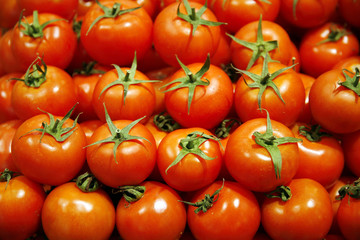 Group Of Fresh Tomatoes Background. Red Tomatoes On A Market Clo
