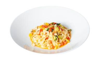pasta with vegetables on a white plate