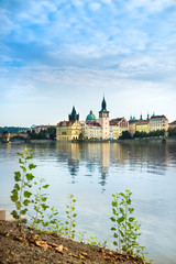 Fototapeta premium Historical buildings and Charles Bridge in Prague