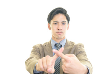 禁止の意思表示をするビジネスマン