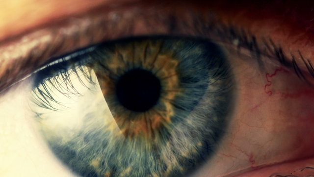 Extreme close up human eye iris in 4K UHD video.