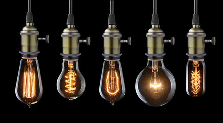 Set of vintage glowing light bulbs on black