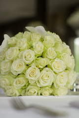 Image of bouquet of flowers on table in hotel