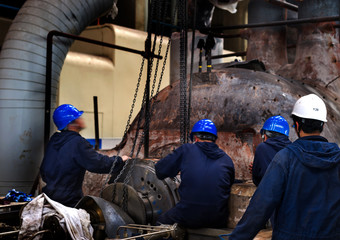 maintenance engineers checking technical data of heating system