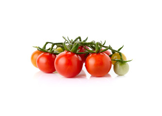 fresh cherry tomatoes with stem isolated on white background