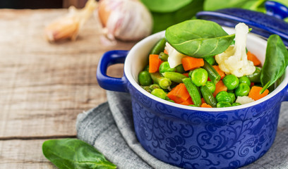 Assorted vegetables with spinach leaves