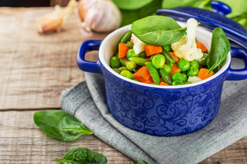 Assorted vegetables with spinach leaves