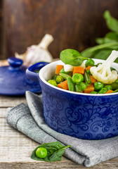 Assorted vegetables with spinach leaves