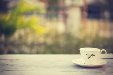 Hot latte coffee cup in coffee shop - vintage effect style pictu